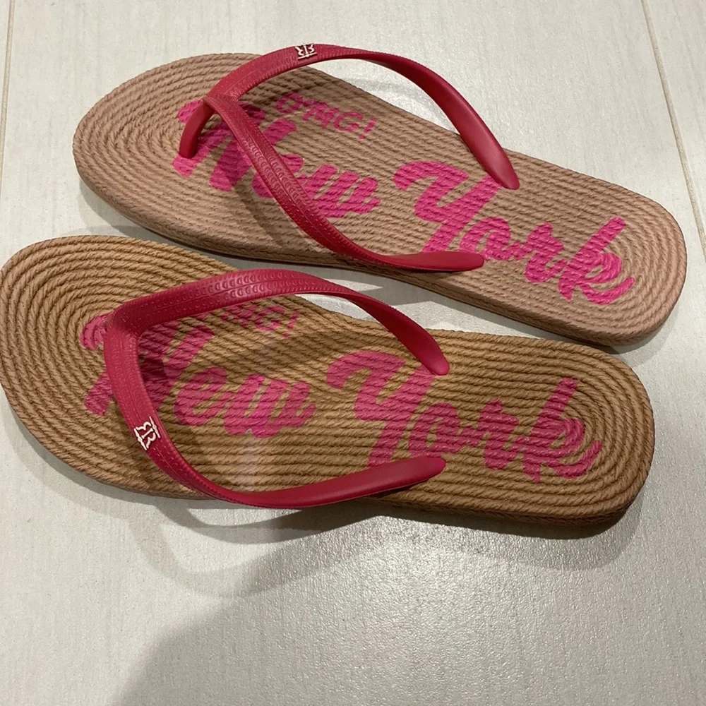 Omg! New York pink and tan flip flops